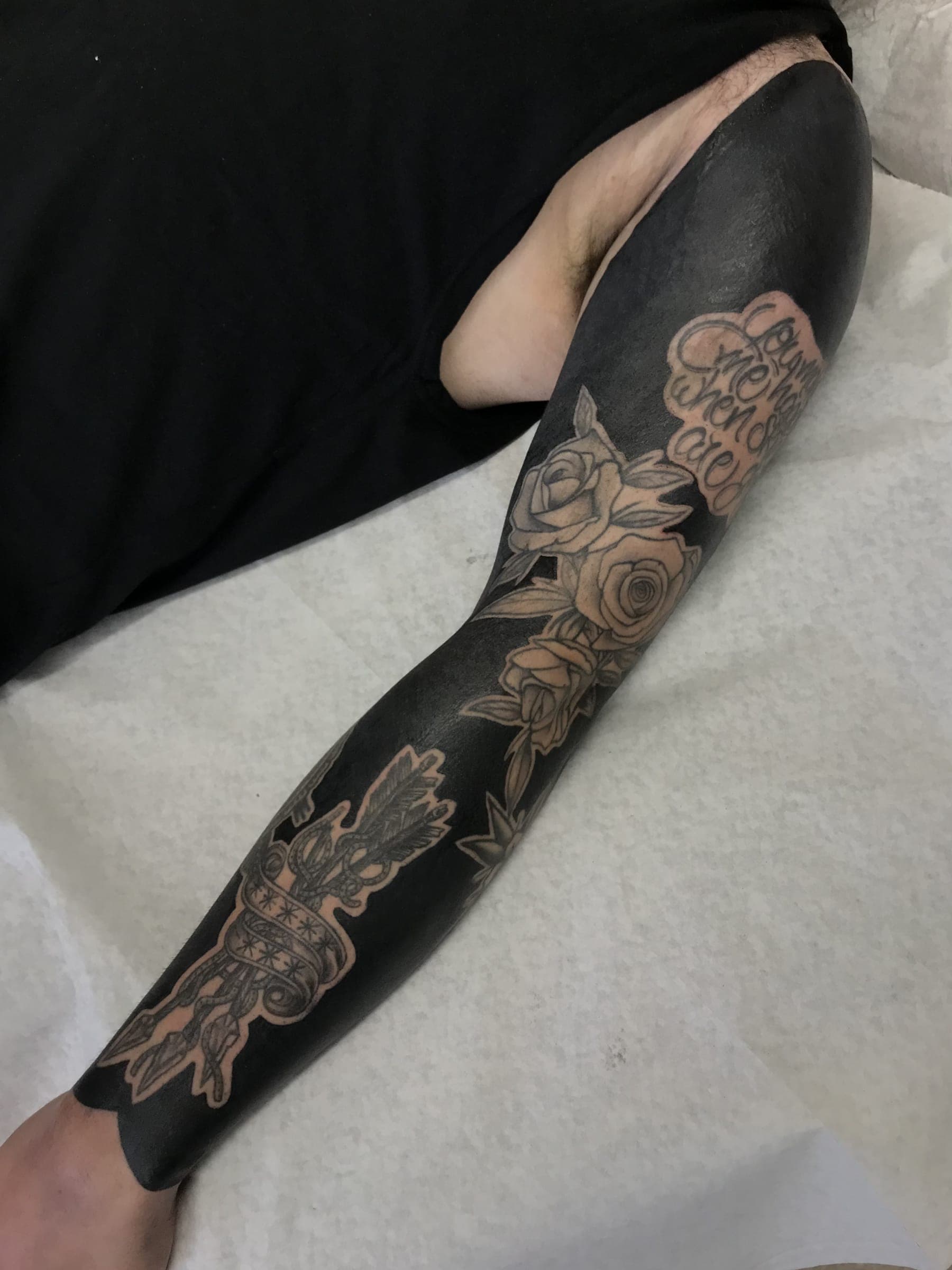 Solid black with roses, scrollwork and a crown left in negative space