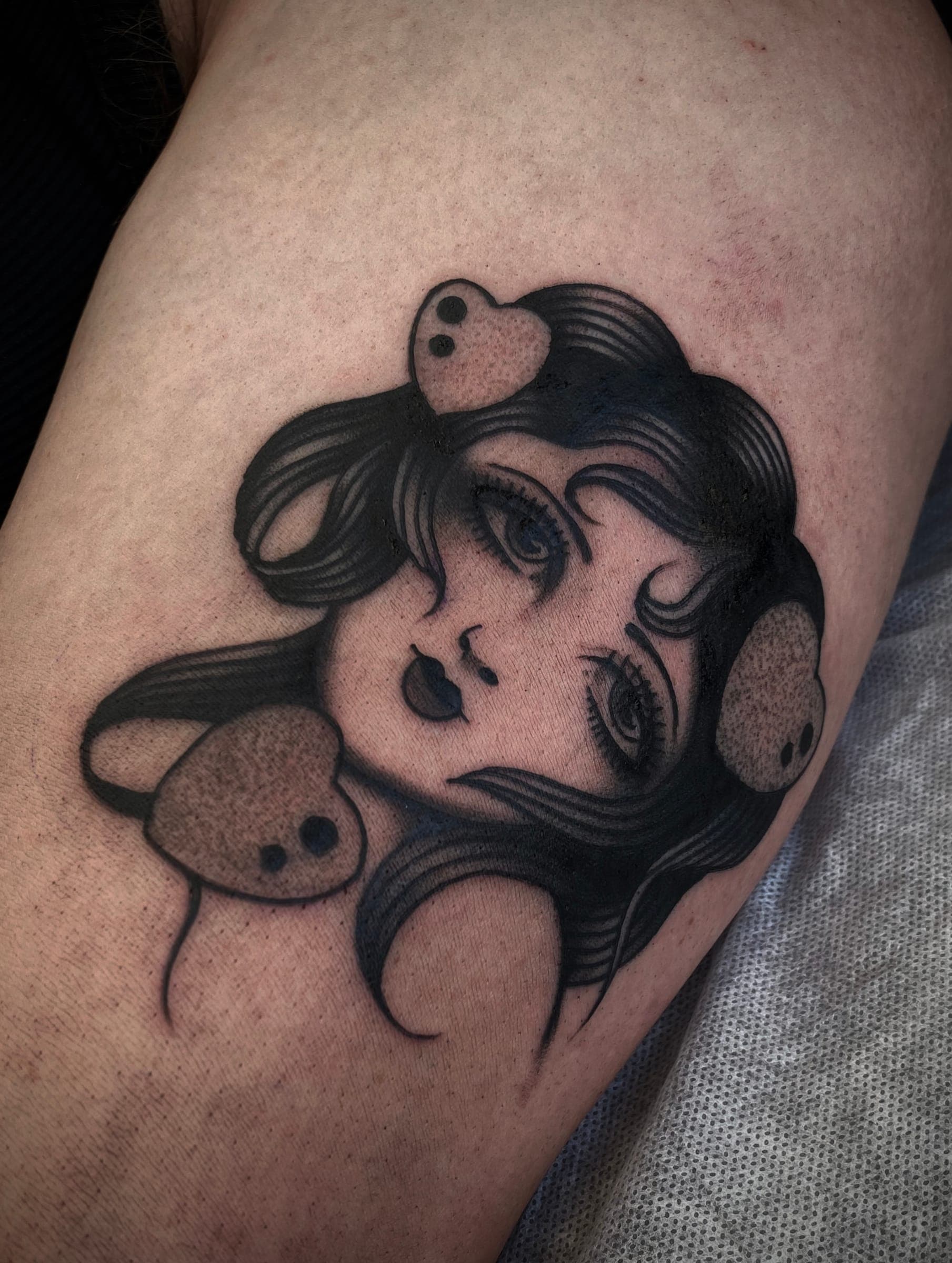 Black traditional lady head tattoo with three small mice nestled in her hair
