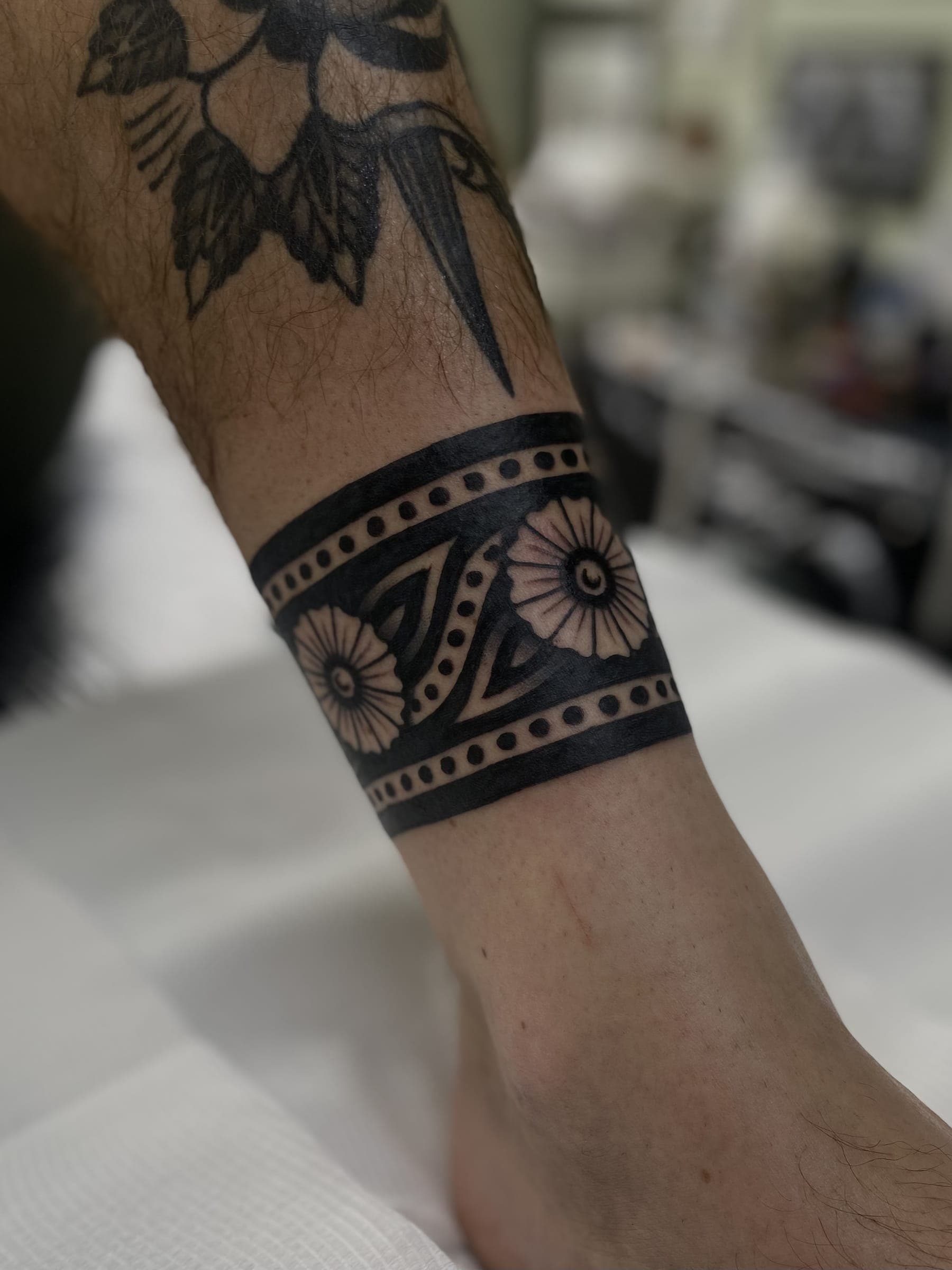 Solid black with two flower medallions and dot borders
