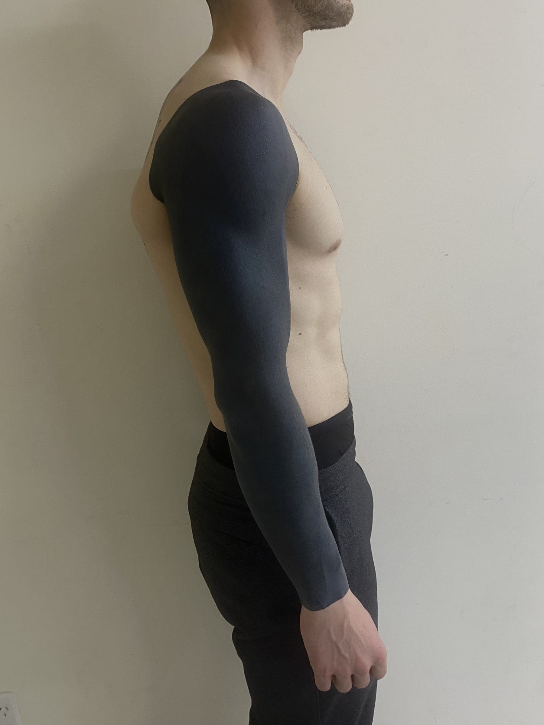 Full coverage blackout tattoo in solid black ink