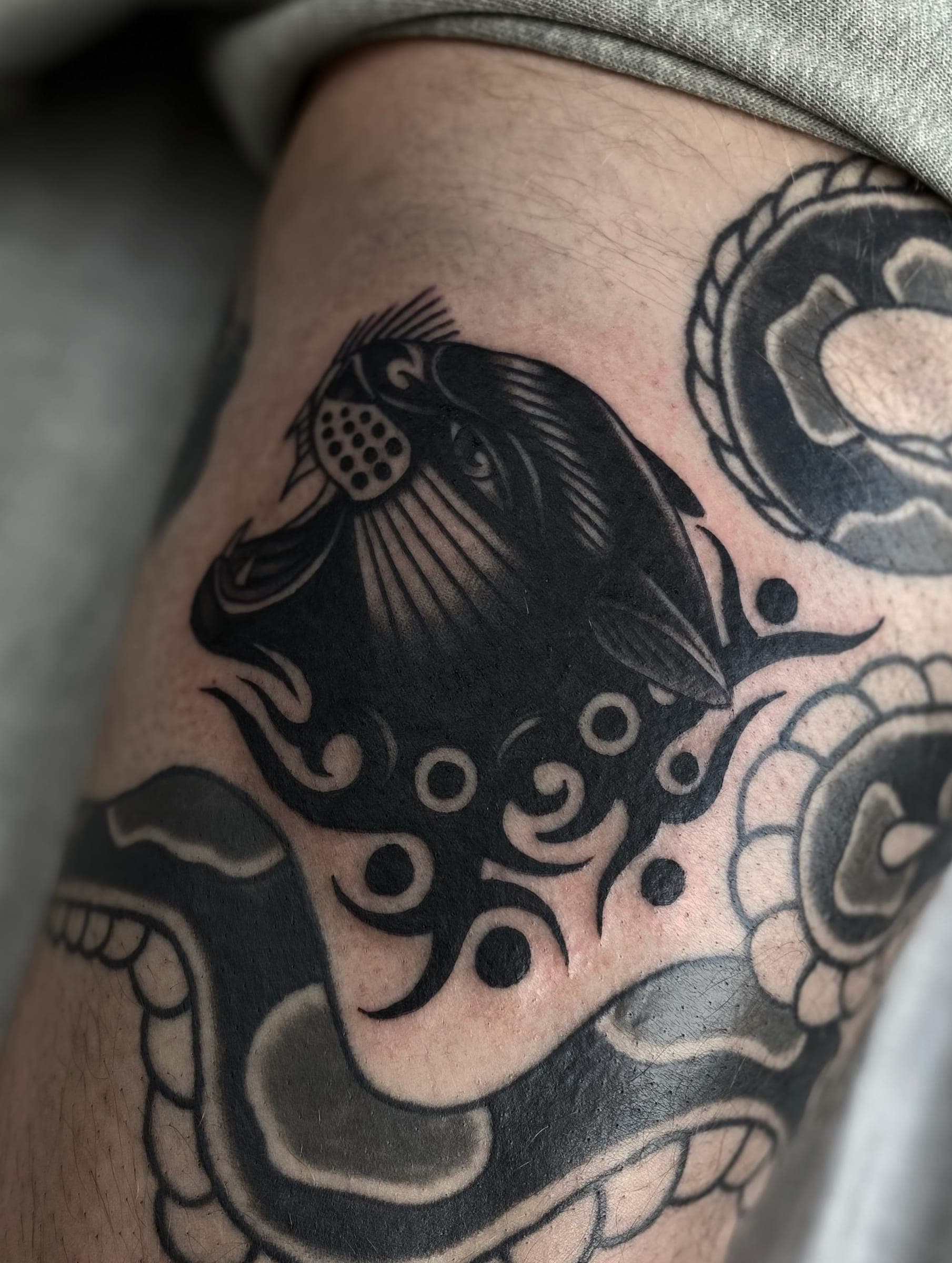 Black panther head with octopus tentacles tattooed in blackwork